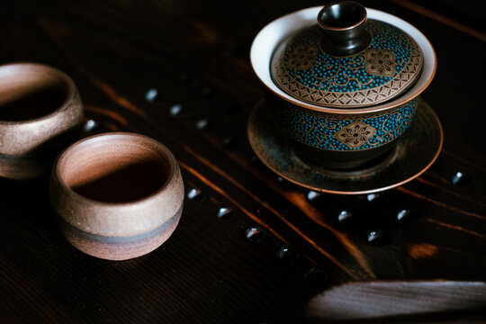 Gaiwan on a wooden chaban. Chinese tea ceremony.