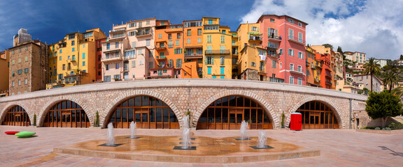 Panorama of colorful old town and beach in sunny Menton, French Riviera, France