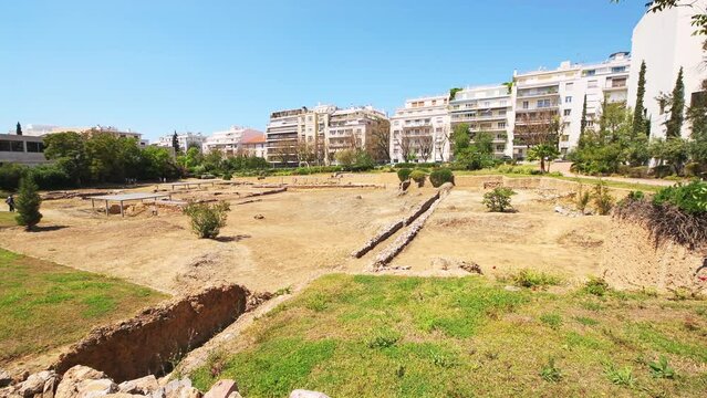 Archaeological Site of Lyceum of Aristotle ruins building, temple of Apollo Lyceus in Athens Greece wide angle panning shot in summer