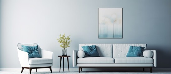 Living room with white sofa blue armchair and wall posters
