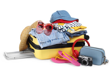 Open suitcase with clothes, beach accessories and shoes isolated on white. Summer vacation