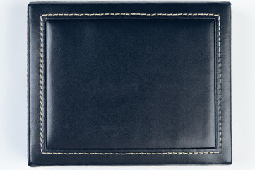 Black leather surface with stitches