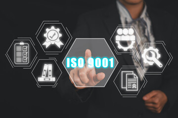 Iso 9001 concept, Business woman hand touching iso 9001 icon on virtual screen. - obrazy, fototapety, plakaty