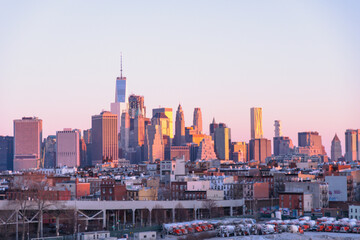 Fototapeta na wymiar Early morning view of New York City skyline from the subway platform in Brooklyn