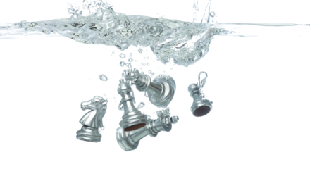 Silver Chess many Figure throw fall into clear water with air bubble. Unpredictable failure of business plan strategy and human resources organization risk management. White background isolated