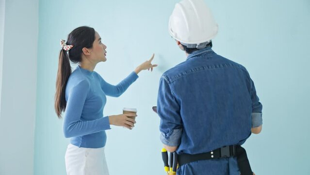 The property Inspector and house owner checks or inspects equipment in the renovation house improvement project.