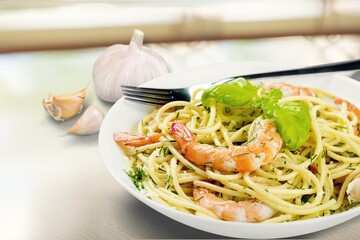 Tasty fresh pasta dish with shrimp in plate