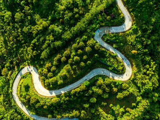 Drone images of flat lay snake road in Java Island