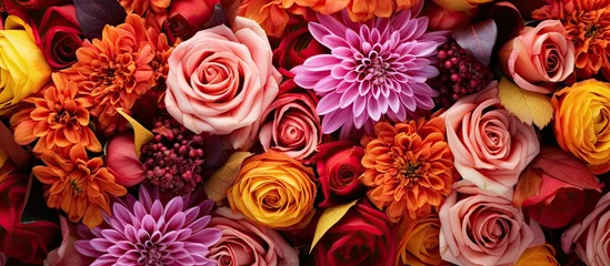 Foto op Canvas Beautiful close up floral composition with autumn colors a colorful bouquet showcasing orange and red flowers Flower shop and florists design idea © 2rogan