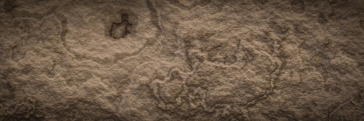 Brown weathered rock surface texture.