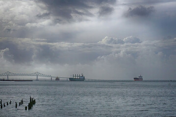 Photograph of three ships on the Columbia river at Astoria, Oregon