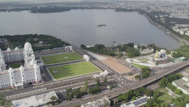 Aerial view of the entire Hussain Sagar Lake and the Telangana Secretariat and Martyrs Memorial situated in Hyderabad The Telugu Thalli Flyover and NTR Marg roads are used by vehicles at Morning.