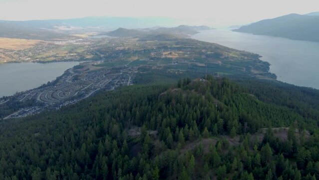 Vast Panoramic Viewpoint in Canadian Mountains overlooking Okanagan Lake and Wood Lake in Lakecountry in British Columbia's Spion Kop Mt. The Lakes. Kelowna, Vernon, Carrs Landing, Wineries. 4K Drone.