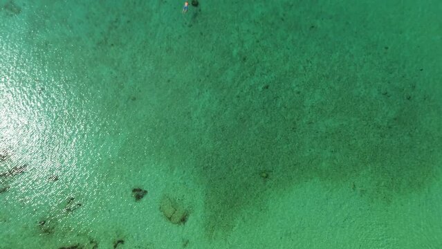 From Above to Ground Kalogria Beach Aerial View of sandy paralia Kalogria close to Nikiti and Elia Nikitis in Halkidiki, Greece. Turquoise clear blue water from above with water reflexion