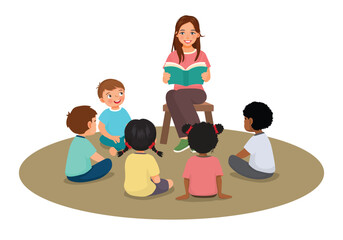 Young female teacher explaining lesson telling story to students sitting on the floor

