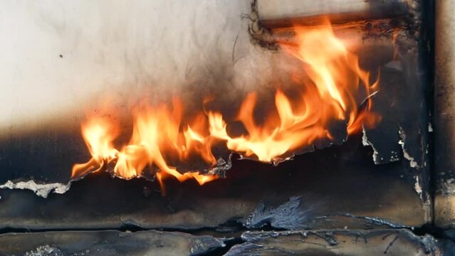 Burning seam from cutting metal after exposure to high temperature fire.