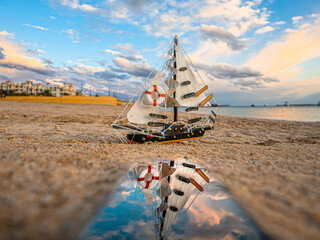 ship on the beach toy reflection