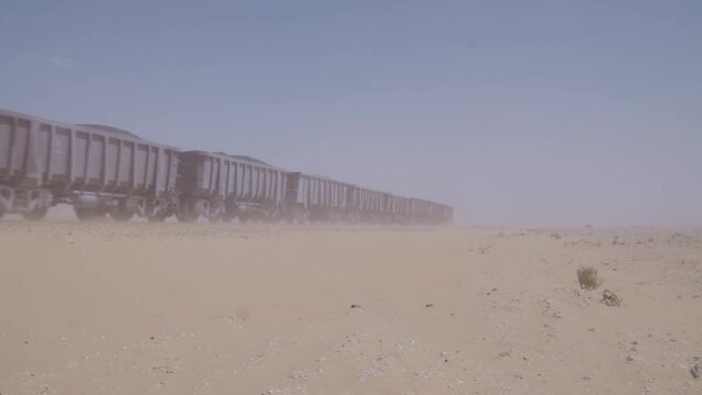 The Iron Ore Train of Mauritania. The Desert train. Sahara Desert. the train is 2.5km long and runs through 700km through the Sahara desert to the coast. it is naicknamed the backbone of the Sahara.