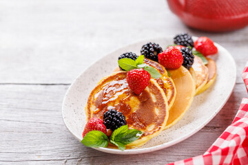 Tasty homemade pancakes with berries