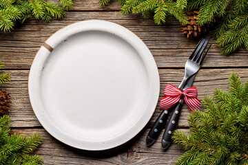 Table setting from above with empty plate, Christmas Fir tree