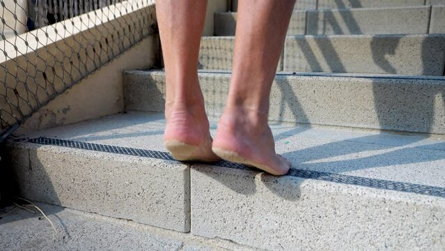 Leg stretching exercises on the edge of stairs. Different ways to workout