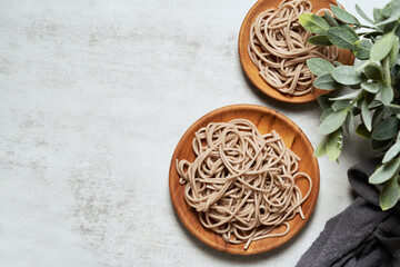 Obraz na płótnie Canvas soba noodle on white table background. soba noodle table background. soba noodle pasta top view flat lay overhead