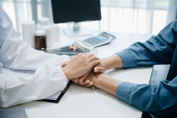 The doctor holds the patient’s. hand Healthcare and medical concept. In hospital.