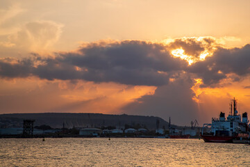 Fototapeta premium dramatic sunset over the Sea at Port in Varna, Bulgaria