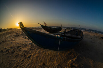 The bows of wooden boats of Vietnamese fishermen on a beach in Ba Ria, Vung Tau, Ho Coc beach