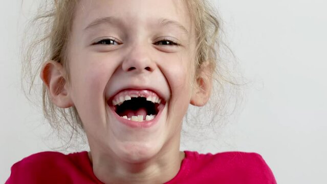 Cheerful, happy little girl. Close-up . White background