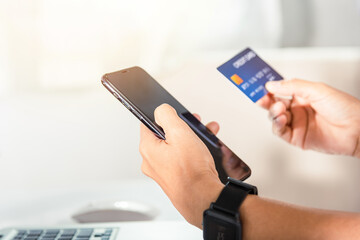 Female register via credit cards on mobile phone make digital payment security online, Business woman hands holding credit card and smartphone to pay product at home, Internet online shopping concept