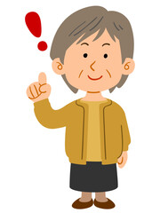 人差し指を立てる黄色いカーディガンを着たシニアの女性　全身
