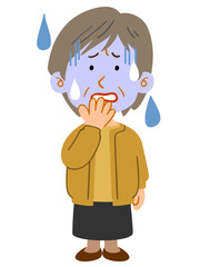 青ざめる黄色いカーディガンを着たシニアの女性　全身
