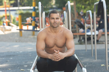 Portrait of sporty handsome strong man. Healthy athletic fitness model posing. Confident sexy...