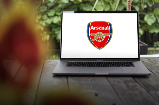 Arsenal London FC logo, an English professional football club based in Holloway, North London, displayed on a MacBook Pro screen