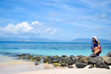 a woman alone enjoying the beach
