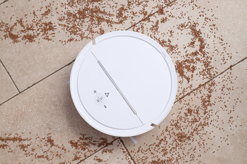 Cordless vacuum cleaner and buckwheat on beige background, top view