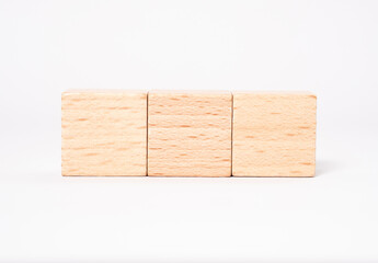 Three empty wooden cubes with place for letters or an mages