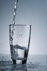 pouring fresh drinking water in hard way that made a glass broken and some part falling down