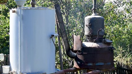 Fruit brandy production in countryside, moonshine still