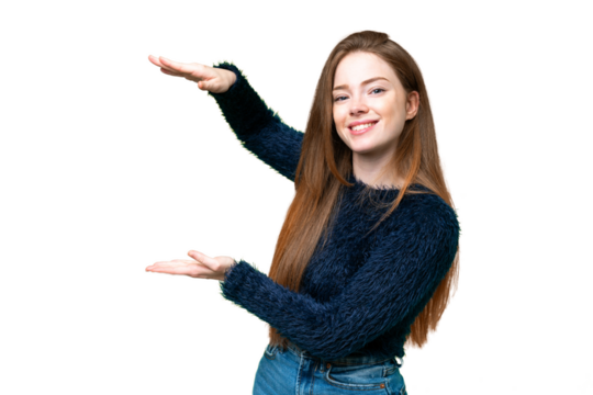 Young pretty woman over isolated chroma key background holding copyspace to insert an ad