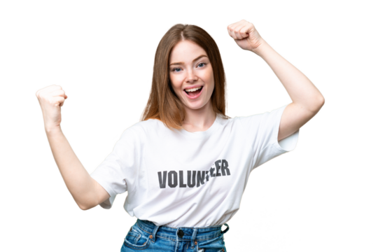 Young volunteer woman over isolated chroma key background celebrating a victory