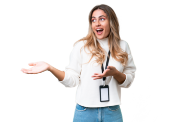 Young Uruguayan woman with ID card over isolated background with surprise expression while looking side