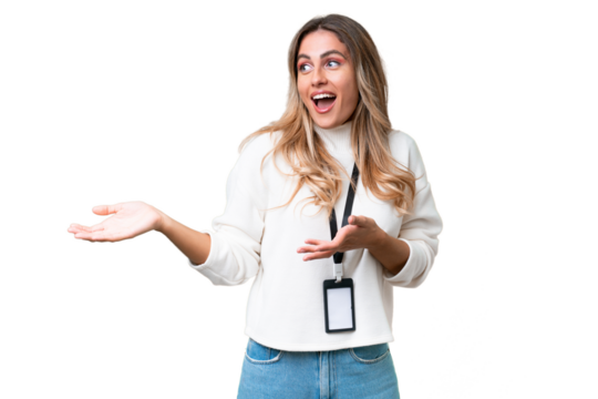 Young Uruguayan woman with ID card over isolated background with surprise expression while looking side