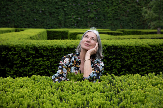 Thoughtful woman spending leisure time in park
