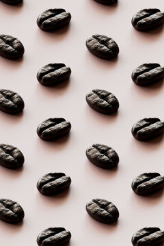 3D pattern of rows of roasted coffee beans against white background