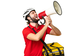 Young delivery man with thermal backpack over isolated chroma key background shouting through a...