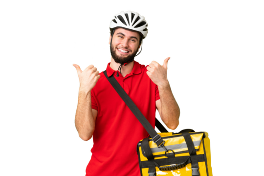 Young delivery man with thermal backpack over isolated chroma key background with thumbs up gesture and smiling