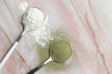 Green and white powder in the spoons. Collagen, protein, moringa, spirulina, hlorophyll, matcha...