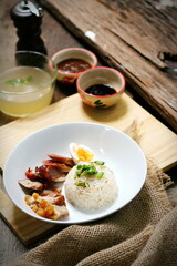 Fototapeta na wymiar Rice with red roast pork topped with sweet sauce. Asian food fusion style